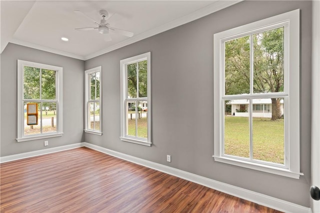 unfurnished room with hardwood / wood-style floors, ceiling fan, and ornamental molding