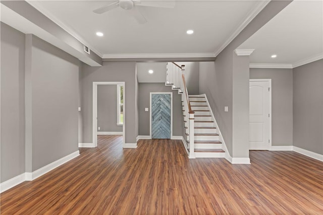 foyer featuring ornamental molding, ceiling fan, and dark wood-type flooring