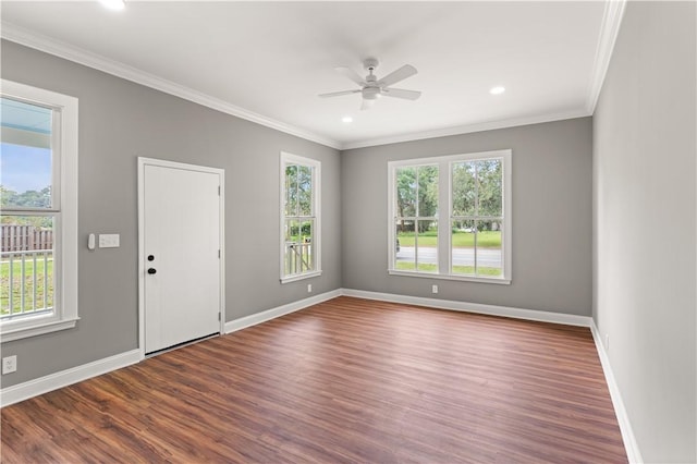 unfurnished room featuring hardwood / wood-style flooring, ceiling fan, and crown molding