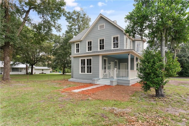 view of front of property featuring a porch and a front yard