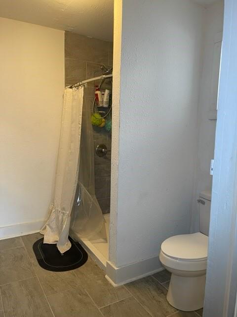 322 Archer St, Waycross, GA 31501 - full bath with baseboards, toilet, and a shower stall