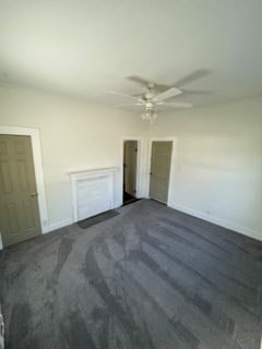 322 Archer St, Waycross, GA 31501 - unfurnished bedroom featuring baseboards and a ceiling fan