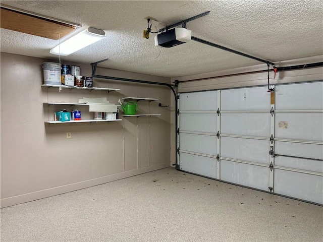 garage featuring baseboards and a garage door opener