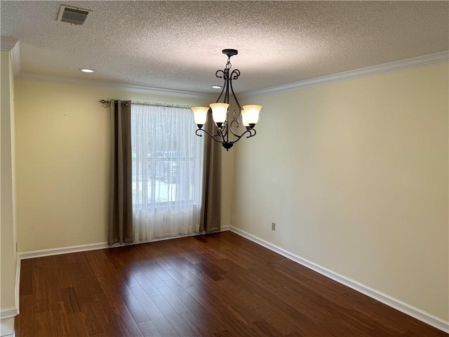 unfurnished room with dark wood-style flooring, crown molding, visible vents, an inviting chandelier, and baseboards