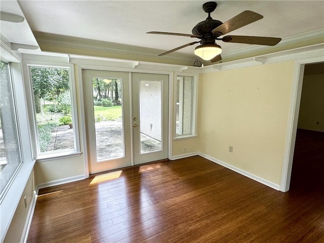 unfurnished sunroom with a ceiling fan and french doors