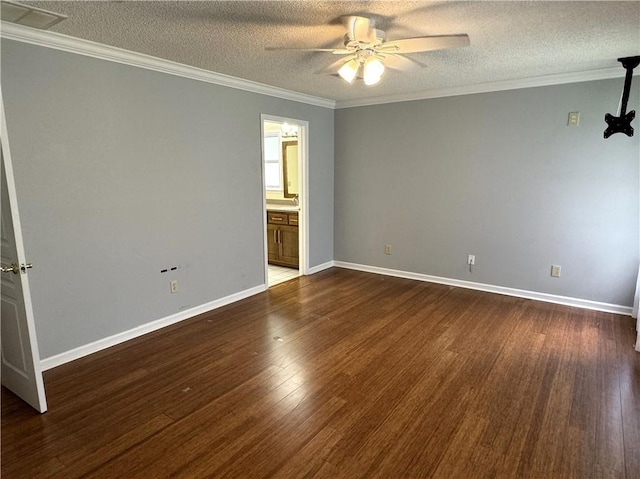 unfurnished room featuring ceiling fan, ornamental molding, dark wood finished floors, and a textured ceiling