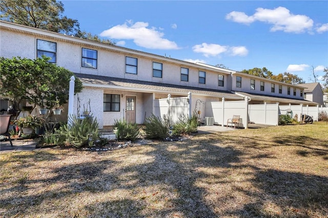 multi unit property with fence and stucco siding