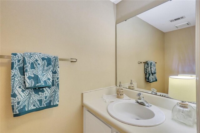 bathroom featuring vanity and visible vents