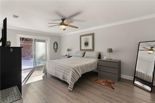 bedroom with access to outside, crown molding, and wood finished floors