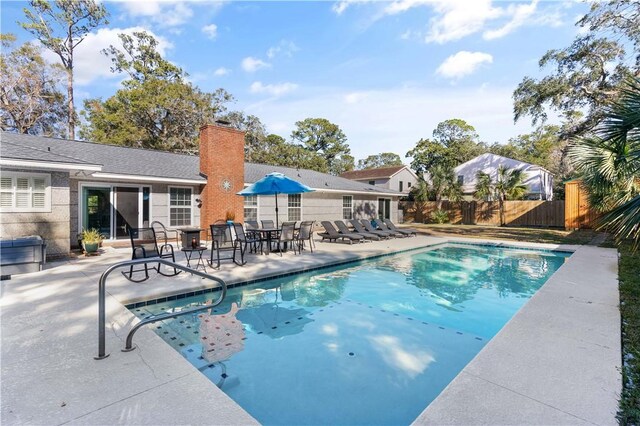 view of pool with outdoor dining space, a fenced backyard, a patio, and a gazebo