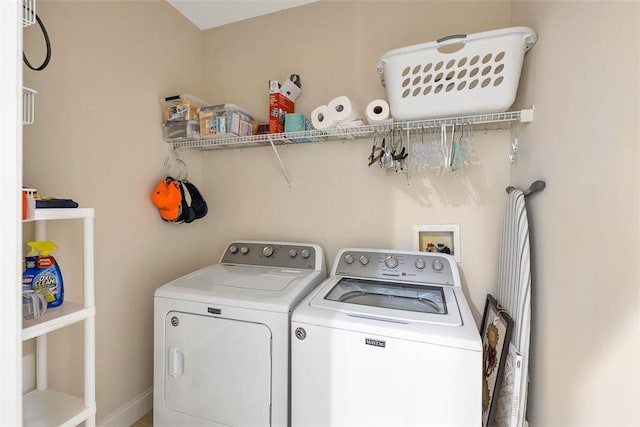 laundry room featuring washing machine and dryer