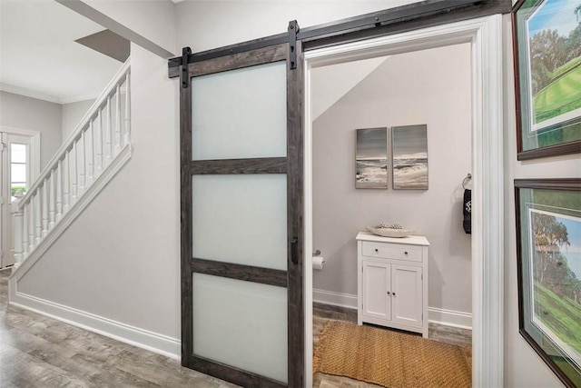 interior space featuring hardwood / wood-style flooring and ornamental molding