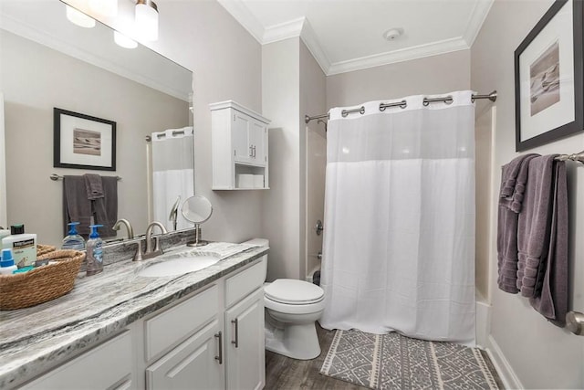 full bathroom featuring hardwood / wood-style flooring, ornamental molding, vanity, toilet, and shower / bath combo