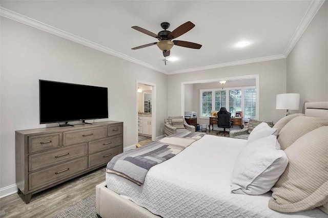 bedroom featuring ornamental molding, ceiling fan, ensuite bath, and light hardwood / wood-style flooring