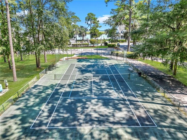 view of sport court featuring a yard