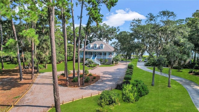 view of property's community with a lawn