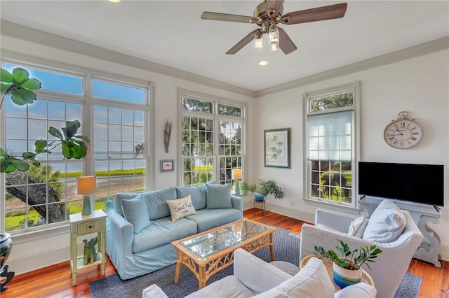 sunroom featuring ceiling fan