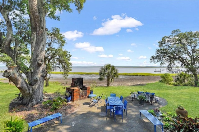 view of patio with a water view