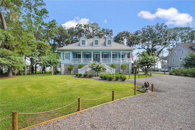 view of front of house featuring a front yard and covered porch