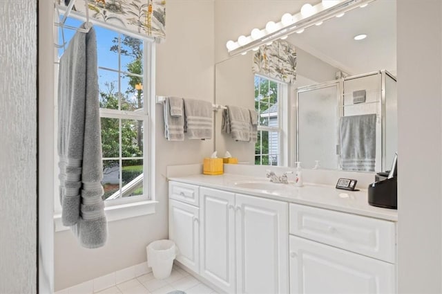23 W Lake Dr, Saint Simons Island, GA 31522 - full bath with a shower stall, vanity, tile patterned floors, and baseboards