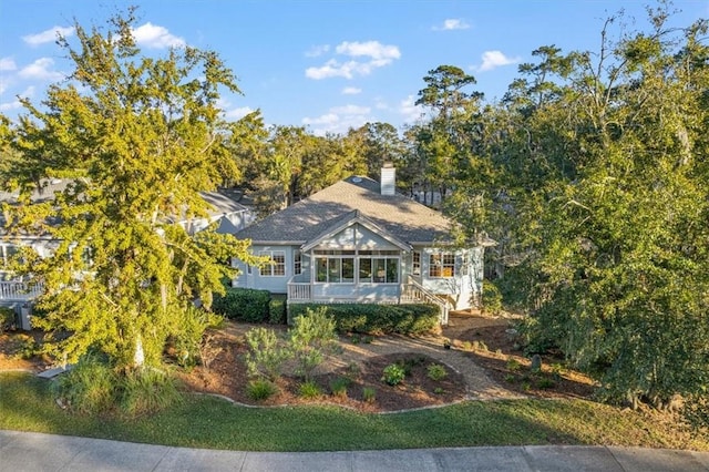 23 W Lake Dr, Saint Simons Island, GA 31522 - view of front of property with a sunroom