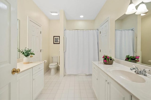 23 W Lake Dr, Saint Simons Island, GA 31522 - bathroom featuring toilet, vanity, tile patterned floors, and curtained shower