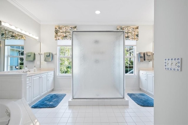 bathroom with tile patterned floors, crown molding, vanity, and a shower with shower door