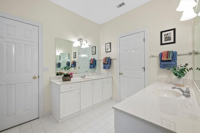23 W Lake Dr, Saint Simons Island, GA 31522 - bathroom with two vanities and tile patterned flooring