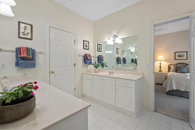 bathroom with tile patterned flooring and vanity