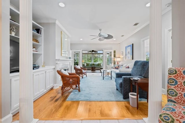 23 W Lake Dr, Saint Simons Island, GA 31522 - living area featuring ornamental molding, ceiling fan, light wood-style flooring, a fireplace, and recessed lighting