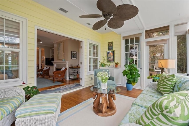 sunroom / solarium with ceiling fan