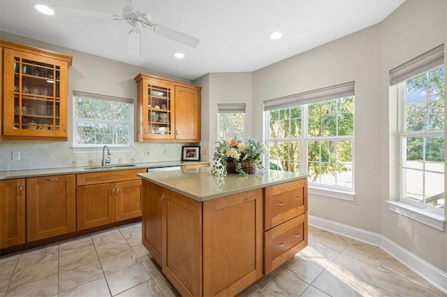 23 W Lake Dr, Saint Simons Island, GA 31522 - kitchen featuring a sink, plenty of natural light, ceiling fan, light marble finish flooring, and recessed lighting