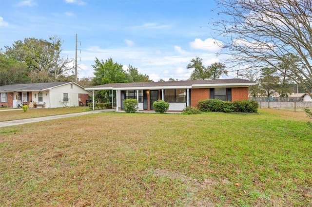 single story home featuring a front yard and a carport