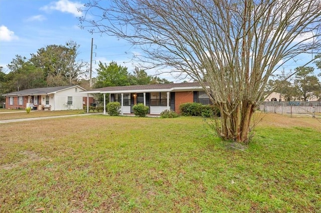 single story home with a front lawn