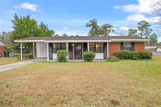 single story home featuring a carport and a front lawn