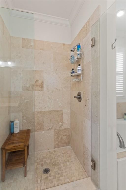 1045 Sinclair Pointe Pt, Saint Simons Island, GA 31522 - bathroom with crown molding, tiled shower, and a bath