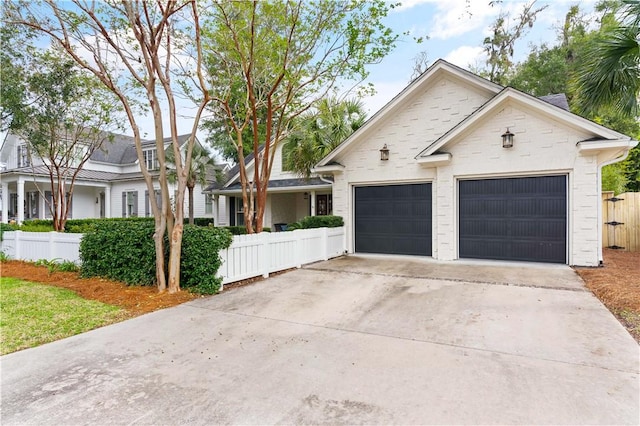 1045 Sinclair Pointe Pt, Saint Simons Island, GA 31522 - view of front of home featuring a garage and driveway