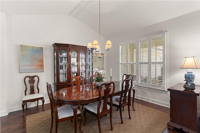 1045 Sinclair Pointe Pt, Saint Simons Island, GA 31522 - dining room with a chandelier, lofted ceiling, and wood finished floors