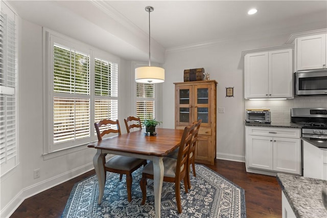 1045 Sinclair Pointe Pt, Saint Simons Island, GA 31522 - dining space featuring ornamental molding, dark wood-type flooring, and recessed lighting