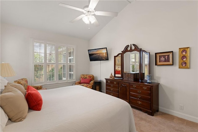 1045 Sinclair Pointe Pt, Saint Simons Island, GA 31522 - bedroom featuring light colored carpet, vaulted ceiling, multiple windows, and a ceiling fan
