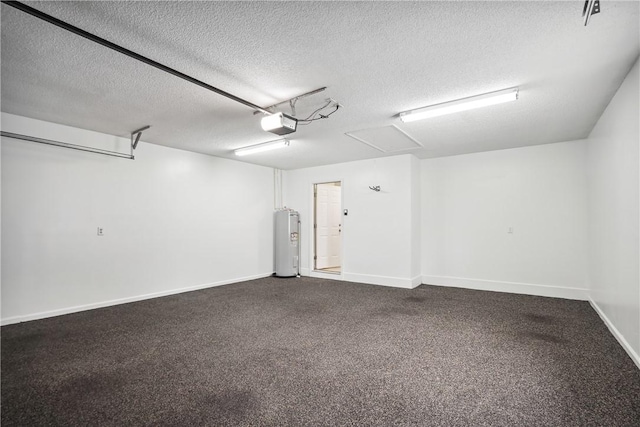 garage featuring water heater and a garage door opener