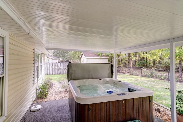 view of patio / terrace with a hot tub