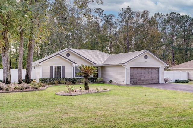 ranch-style house featuring a front lawn and a garage