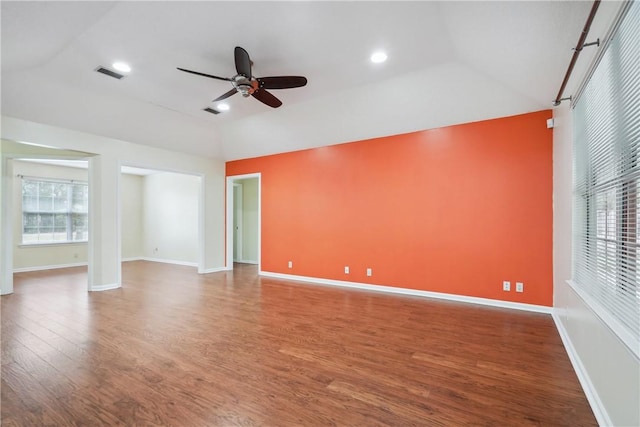 unfurnished room with hardwood / wood-style floors, ceiling fan, and vaulted ceiling