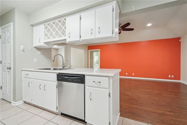 kitchen with light wood-type flooring, ceiling fan, sink, dishwasher, and white cabinetry