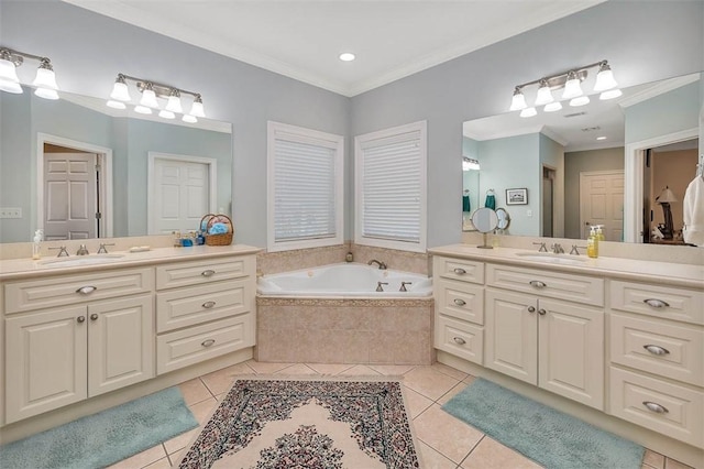 bathroom with tile patterned floors, vanity, ornamental molding, and tiled tub