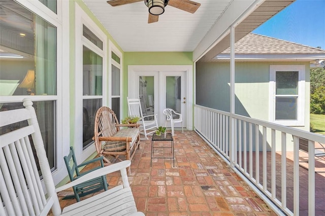 balcony with ceiling fan and a porch