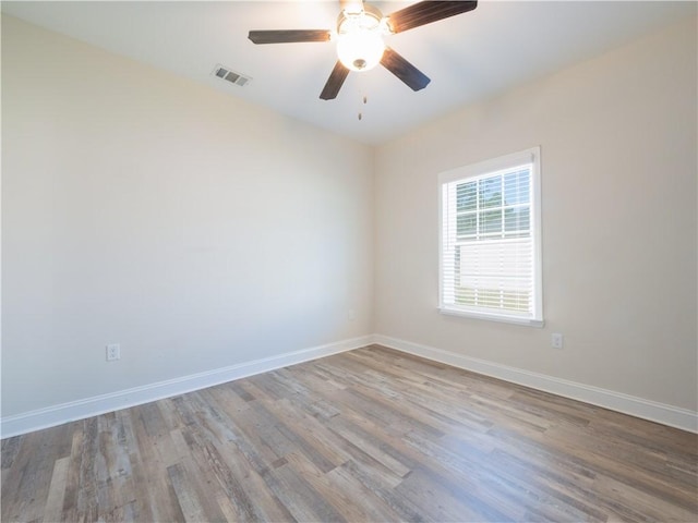 spare room with ceiling fan and light hardwood / wood-style floors