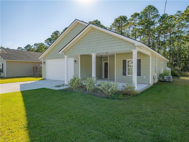 view of front facade with a porch, a garage, a front yard, and cooling unit