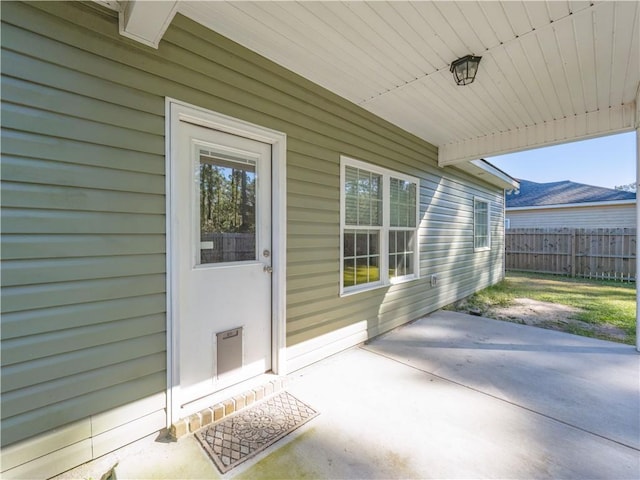 doorway to property with a patio area